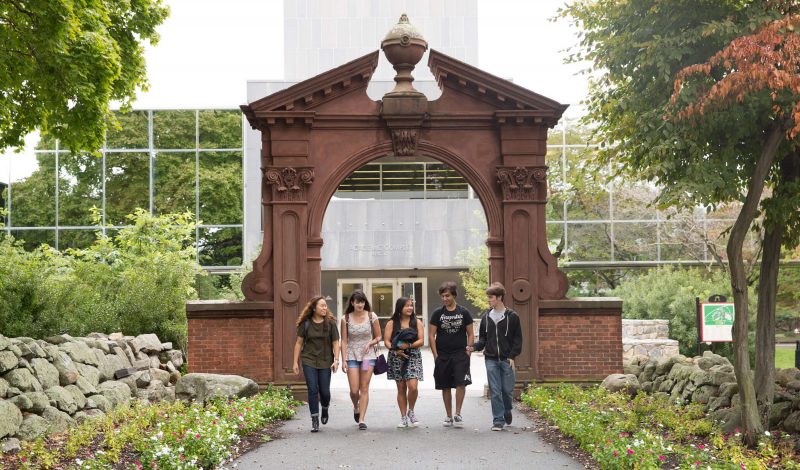 Students walking under Ramapo College archway