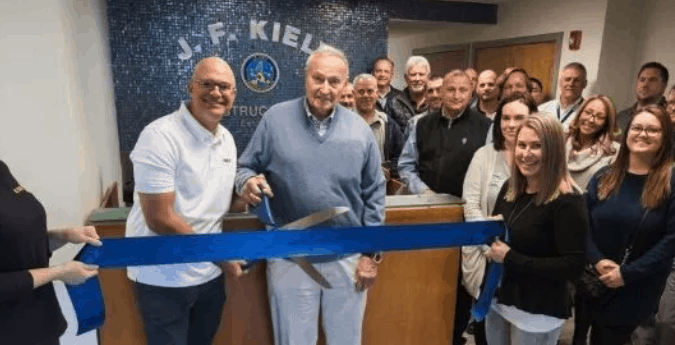 CEO John M. Kiely (left) and Chairman John F. Kiely Cutting the Grand Re-Opening Ribbon at 700 McClellan Street in Long Branch, New Jersey